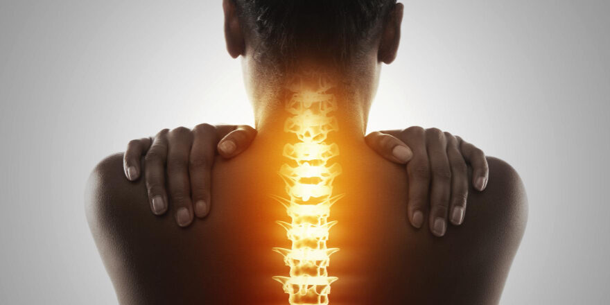 Blog targeting pain rearview shot woman holding her back pain 2025